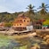 A lush Mexican village situated on the shores of a rocky beach